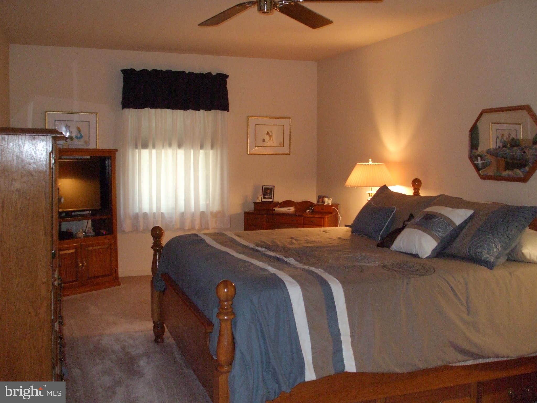 595 Ridgewood Road Bel Air, MD 21014 - Photo 17 of 26 a bedroom with a bed and dresser