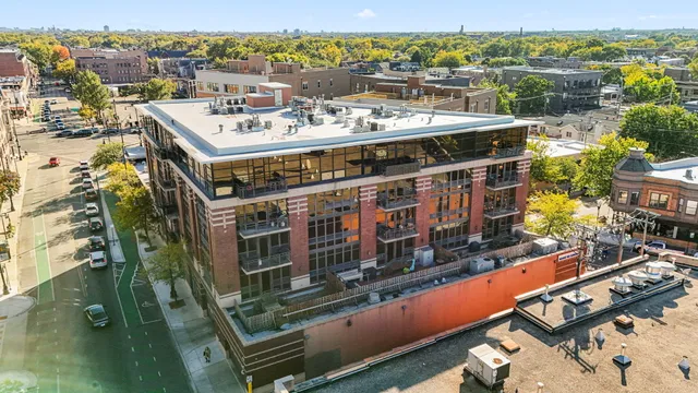 a view of a balcony with a table and chairs