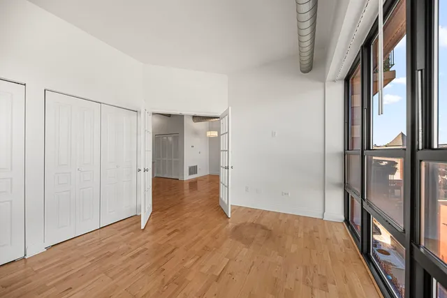 a view of hallway with wooden floor