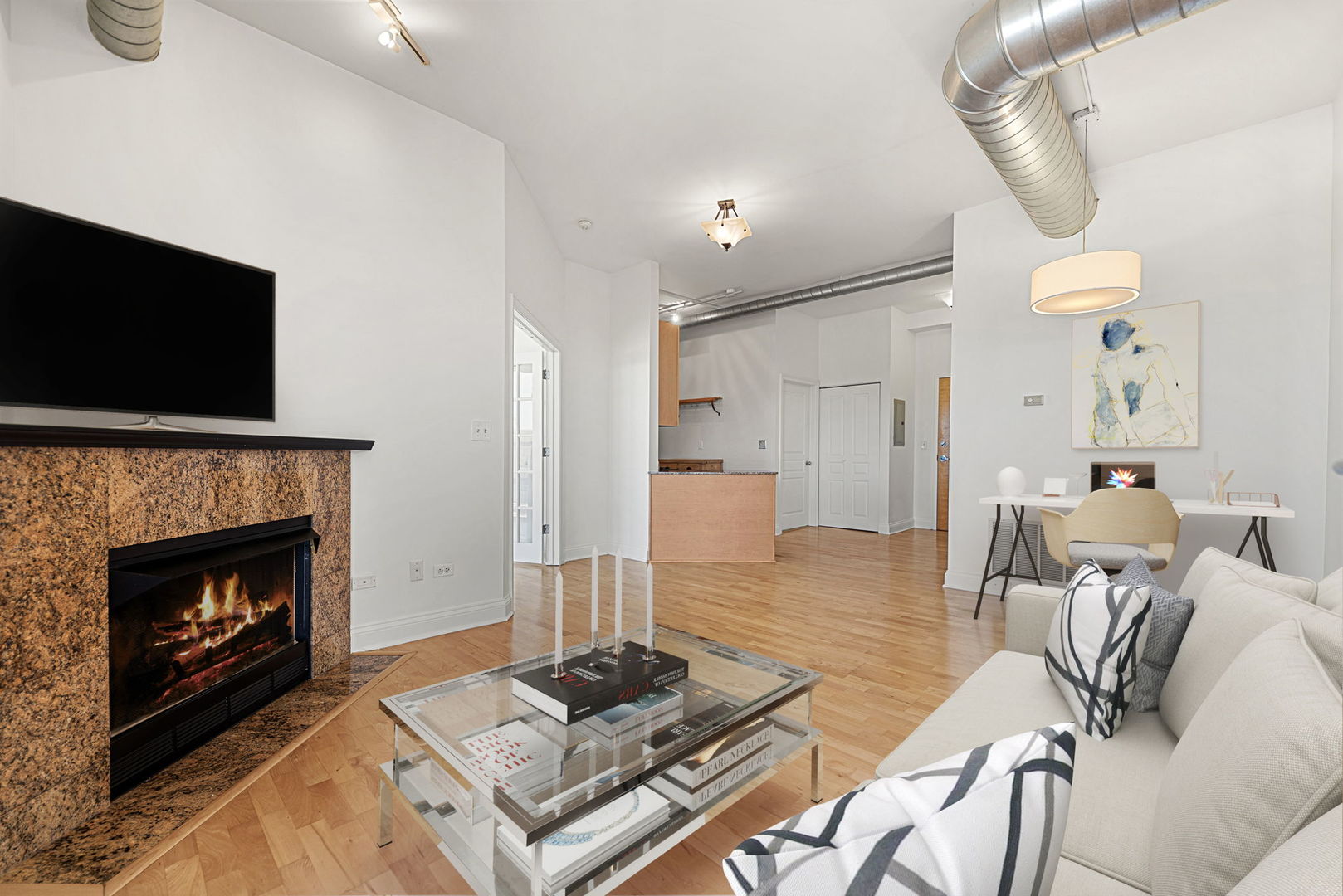 4020 North Damen Avenue, Unit 404 Chicago, IL 60618 - Photo 4 of 17 a living room with furniture and a fireplace