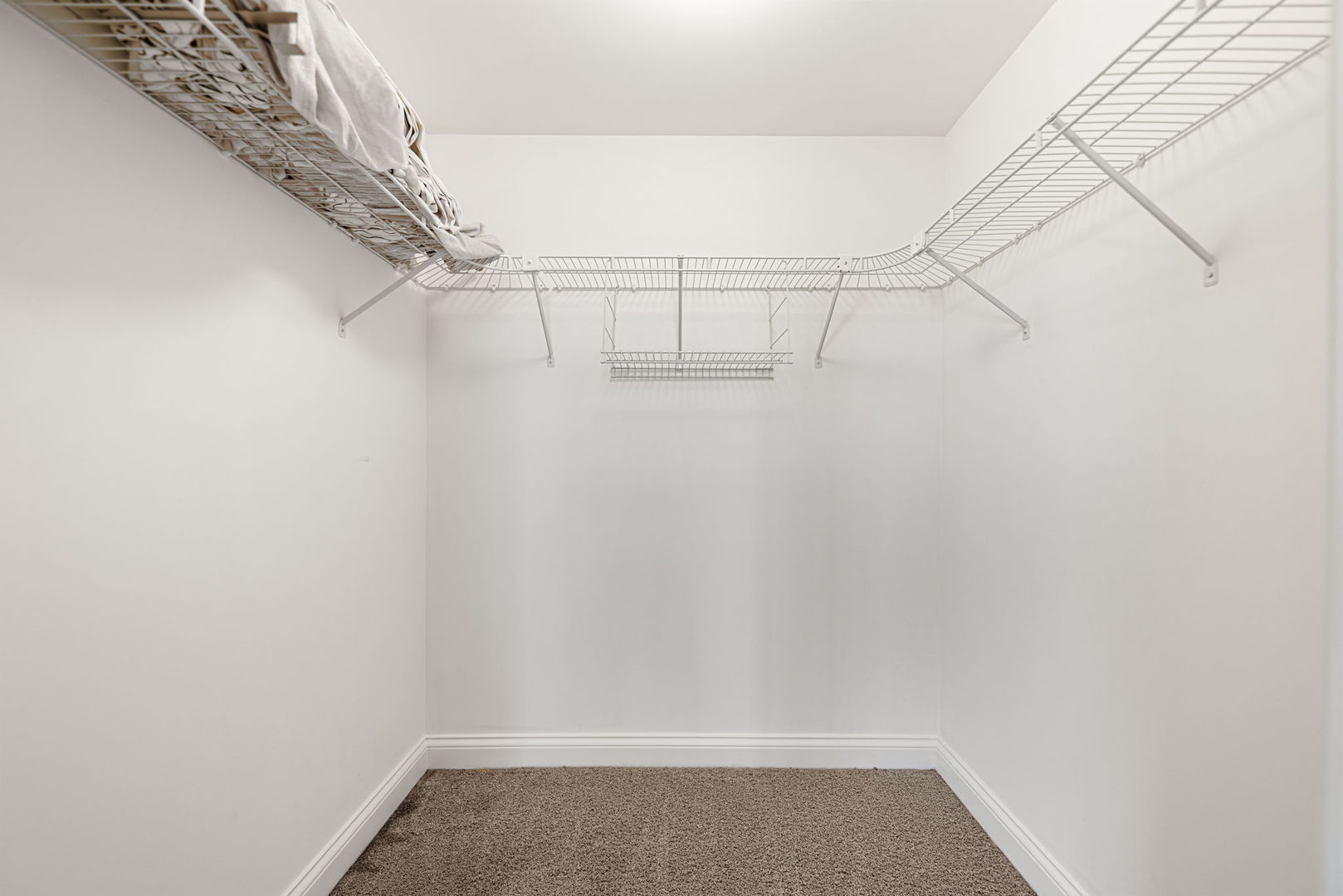 4020 North Damen Avenue, Unit 404 Chicago, IL 60618 - Photo 9 of 17 a view of a room with racks on the wall