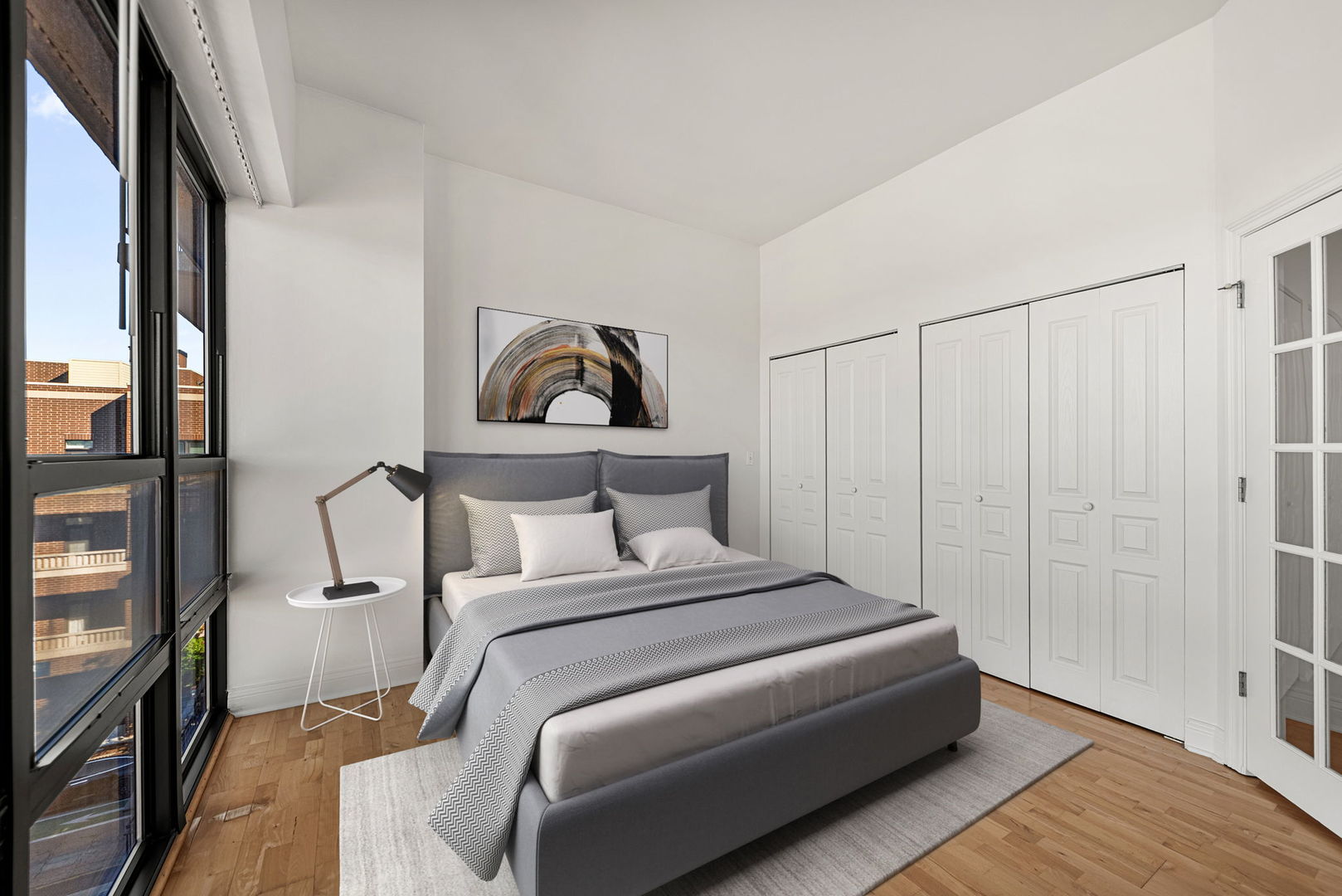 4020 North Damen Avenue, Unit 404 Chicago, IL 60618 - Photo 10 of 17 a bedroom with a bed and a painting on the wall