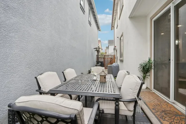 a view of a table and chairs in patio
