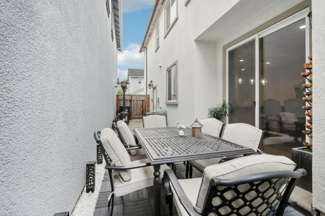 a view of a workspace with furniture and wooden floor