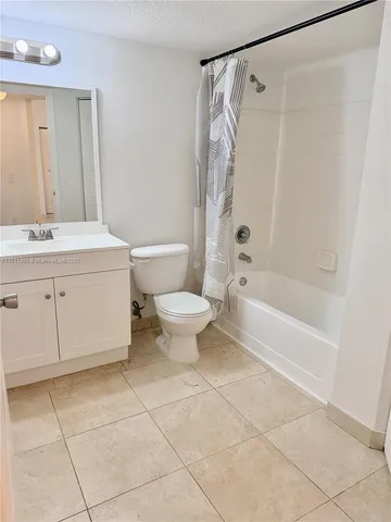 a bathroom with a sink a toilet and a bathtub