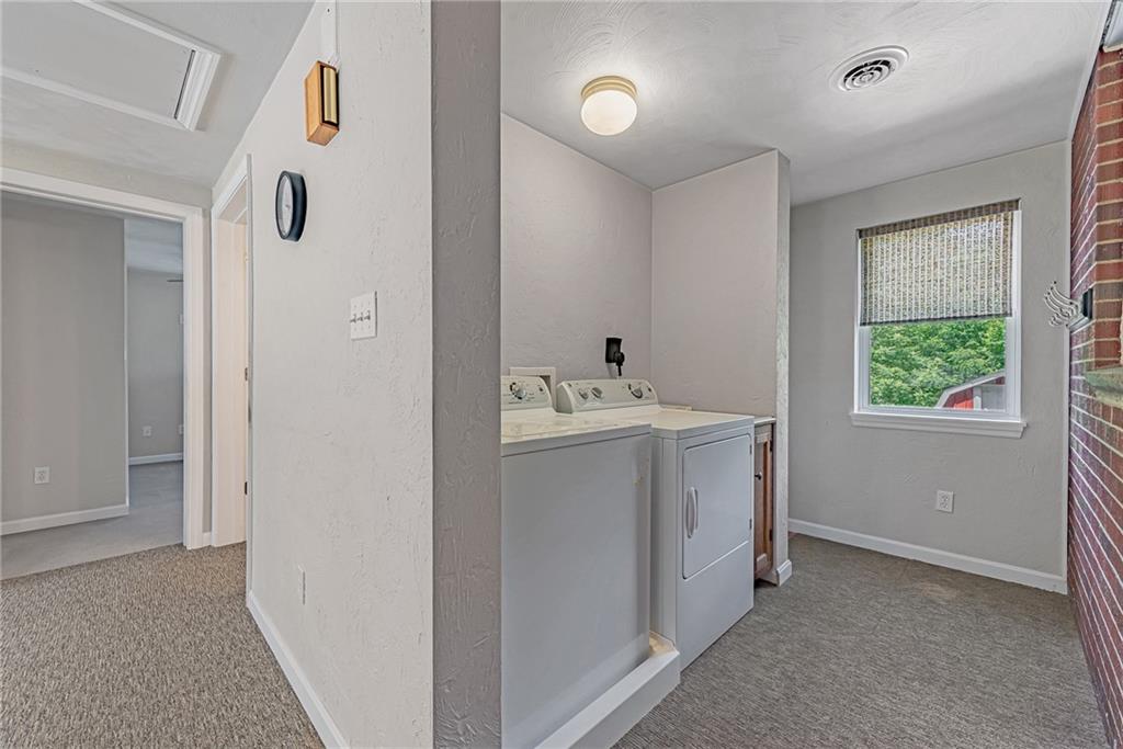 1431 New Stanton Ruffsdale Road Ruffs Dale, PA 15679 - Photo 13 of 25 a utility room with cabinets washer and dryer