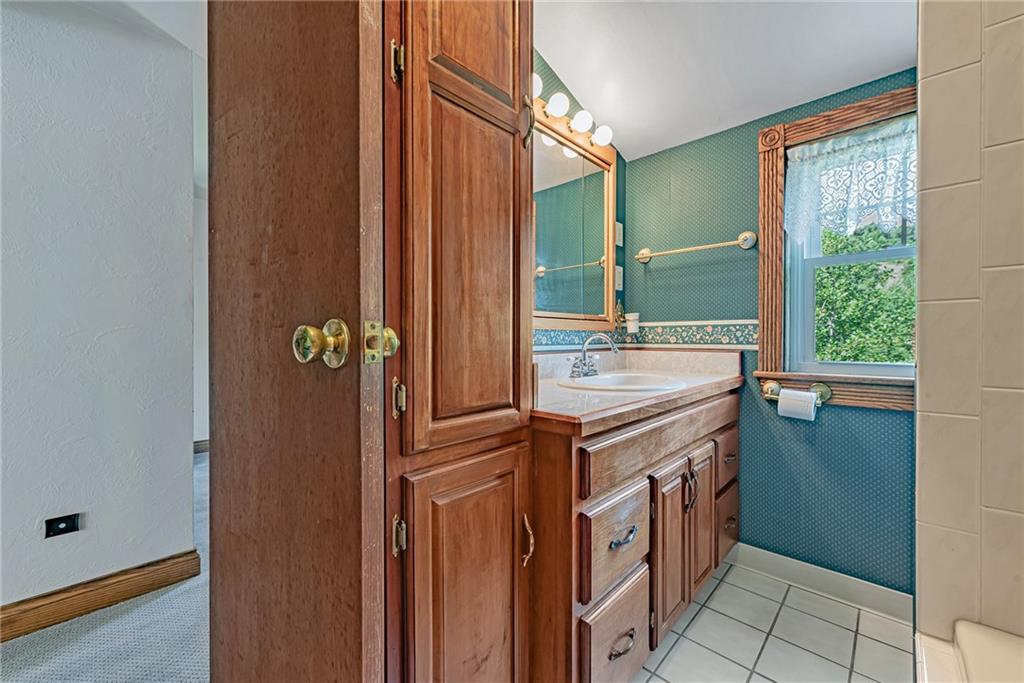 1431 New Stanton Ruffsdale Road Ruffs Dale, PA 15679 - Photo 17 of 25 a bathroom with a sink and a mirror