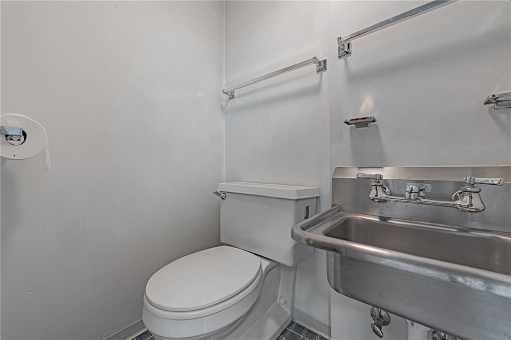 1431 New Stanton Ruffsdale Road Ruffs Dale, PA 15679 - Photo 19 of 25 a white toilet sitting next to a sink