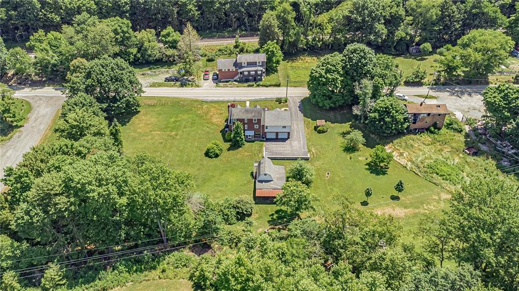 1431 New Stanton Ruffsdale Road Ruffs Dale, PA 15679 - Photo 22 of 25 an aerial view of residential house with outdoor space and trees all around