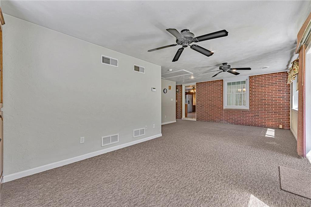 1431 New Stanton Ruffsdale Road Ruffs Dale, PA 15679 - Photo 10 of 25 a view of empty room with ceiling fan