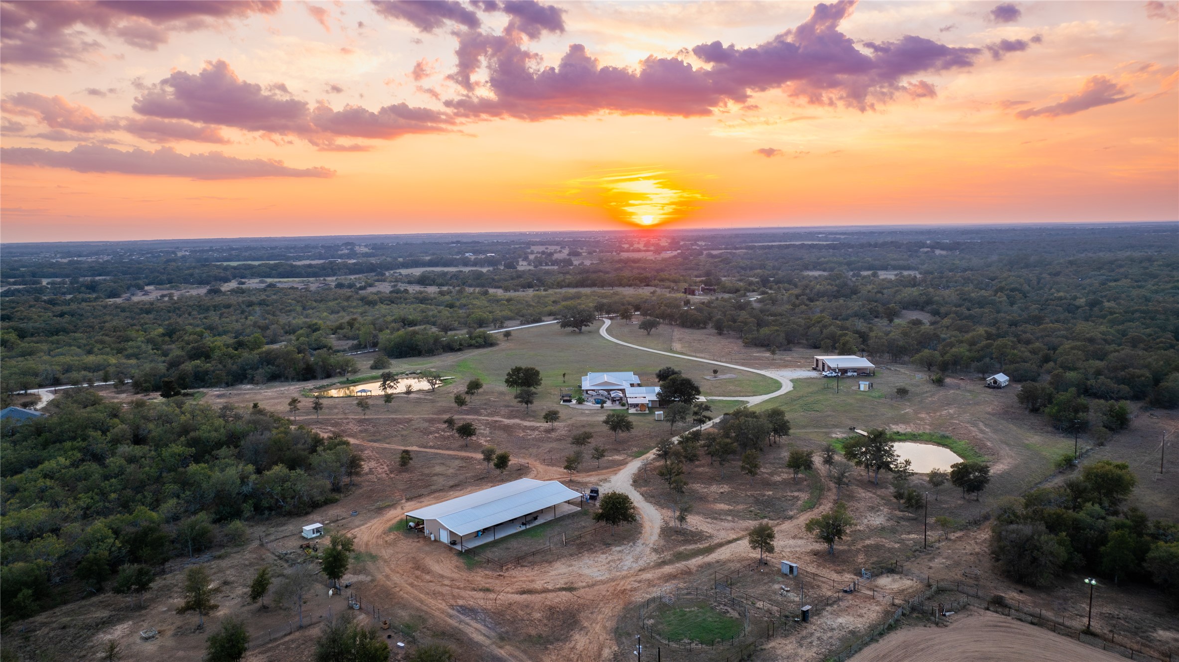 0 Oil Field Road Lockhart, TX 78644 - Photo 1 of 36 a view of a city with sunset view