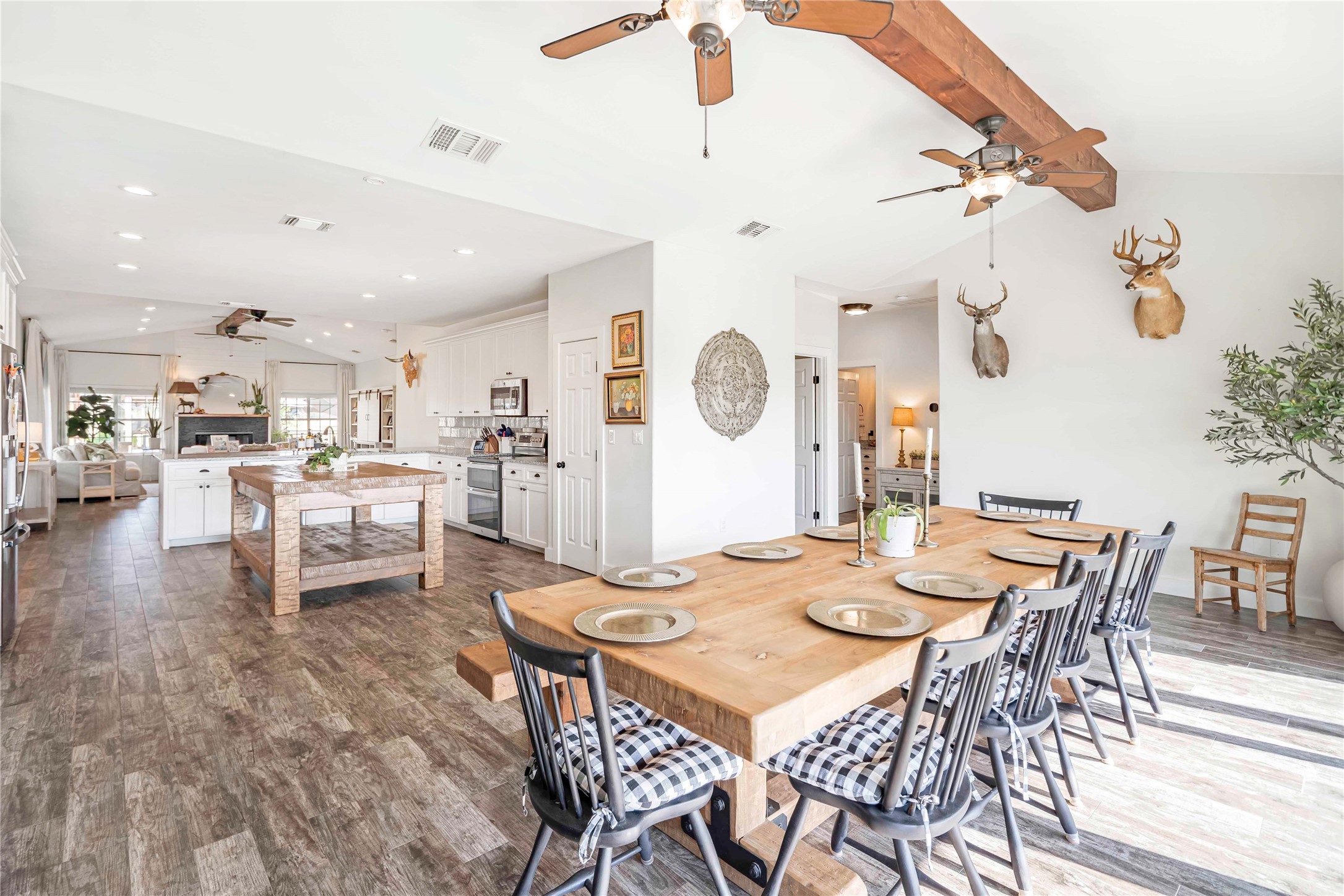 0 Oil Field Road Lockhart, TX 78644 - Photo 15 of 36 a dining room with kitchen island stainless steel appliances furniture a dining table and chairs