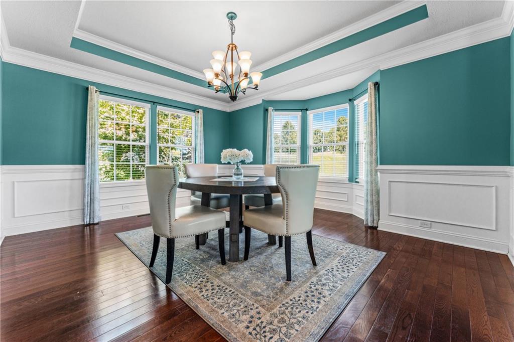 211 Taylor Ridge Lane Mars, PA 16046 - Photo 11 of 50 a view of a dining room with furniture a chandelier and wooden floor
