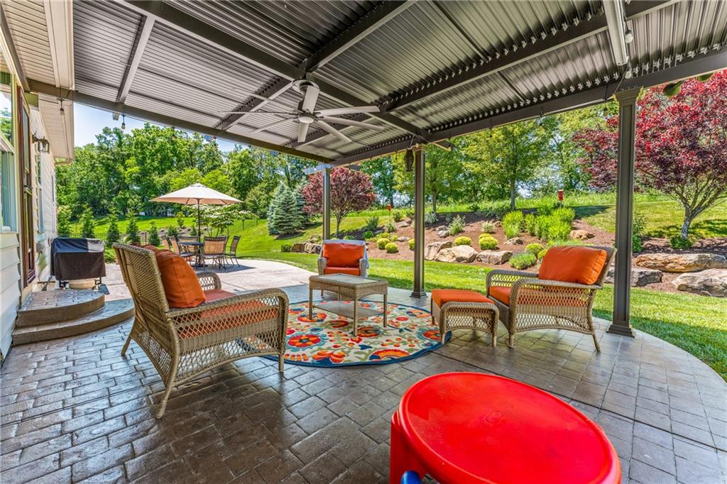 211 Taylor Ridge Lane Mars, PA 16046 - Photo 18 of 50 a view of a chairs and table in patio with a yard