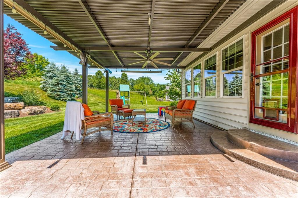 211 Taylor Ridge Lane Mars, PA 16046 - Photo 19 of 50 a view of a patio with table and chairs potted plants with wooden floor and fence