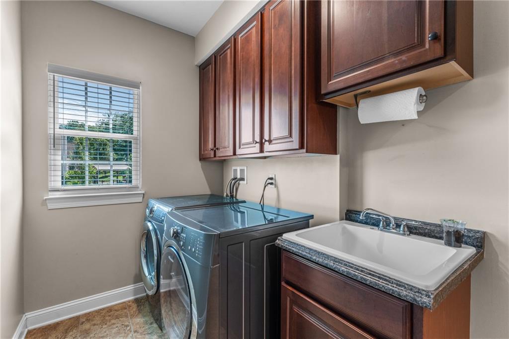 211 Taylor Ridge Lane Mars, PA 16046 - Photo 26 of 50 a kitchen with a sink a stove and a microwave