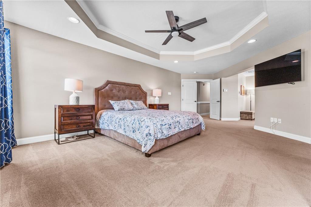 211 Taylor Ridge Lane Mars, PA 16046 - Photo 29 of 50 a bedroom with a large bed a flat screen tv and a chandelier