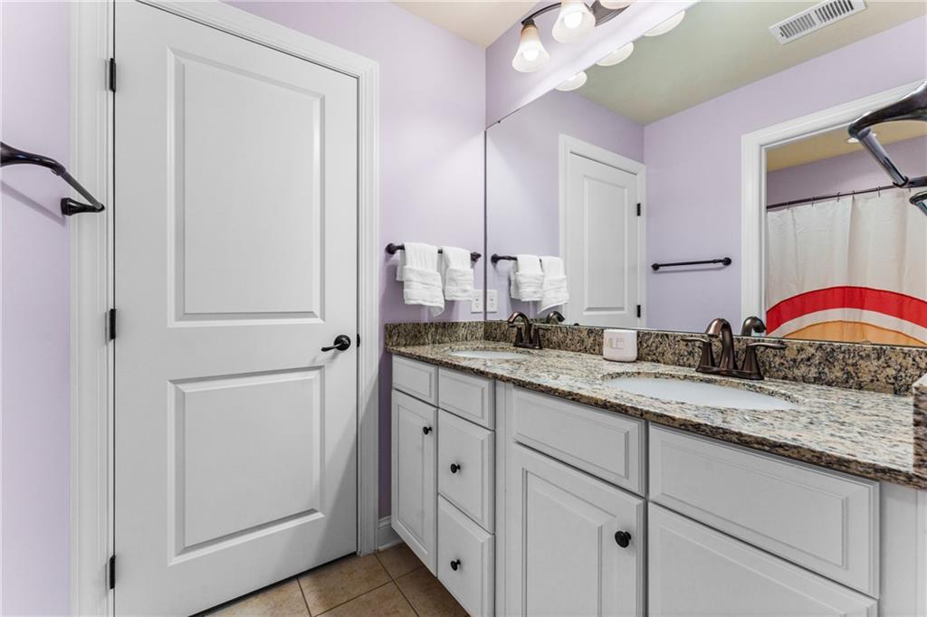 211 Taylor Ridge Lane Mars, PA 16046 - Photo 39 of 50 a bathroom with a granite countertop sink a mirror and a shower
