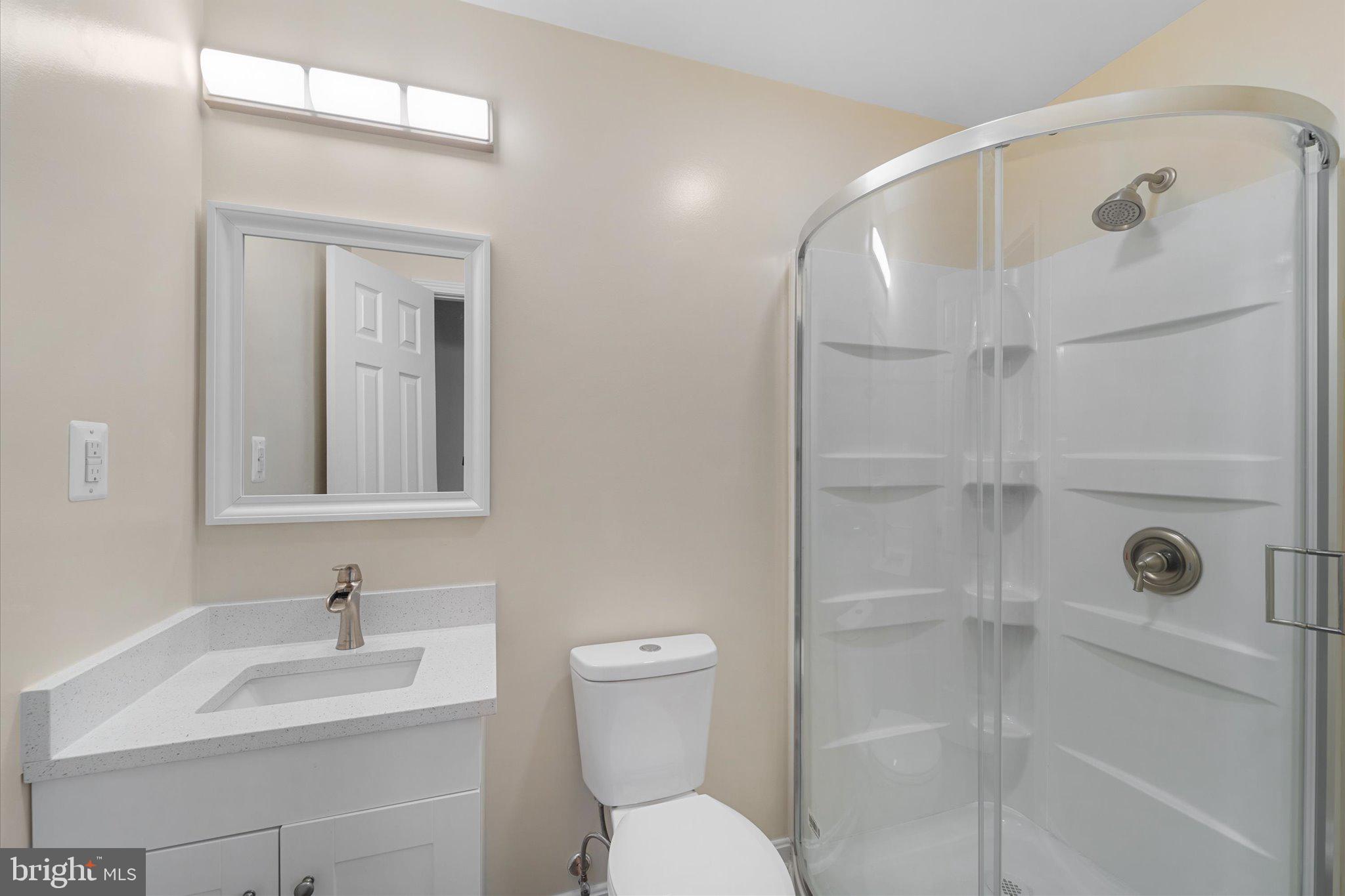 8016 Stillbrooke Road Manassas, VA 20112 - Photo 16 of 41 a bathroom with a sink a toilet and shower