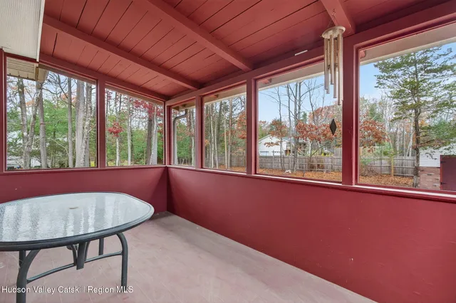 a view of a room with furniture and a window