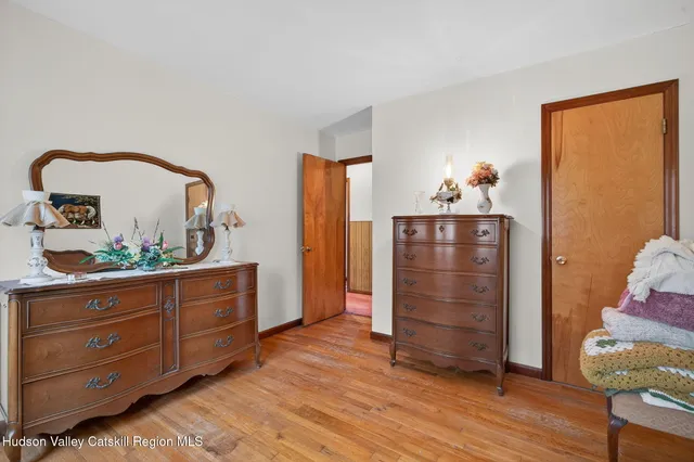 a bed room with a bed and a dresser