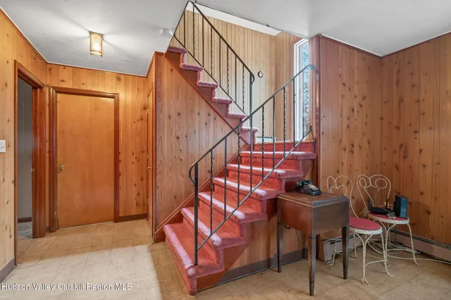 a view of staircase with furniture and stairs