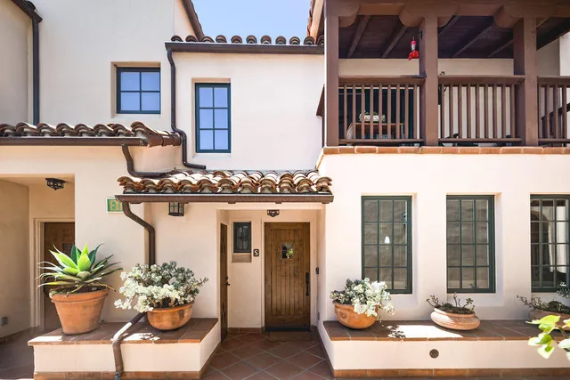 a view of living room filled with furniture and a potted plant