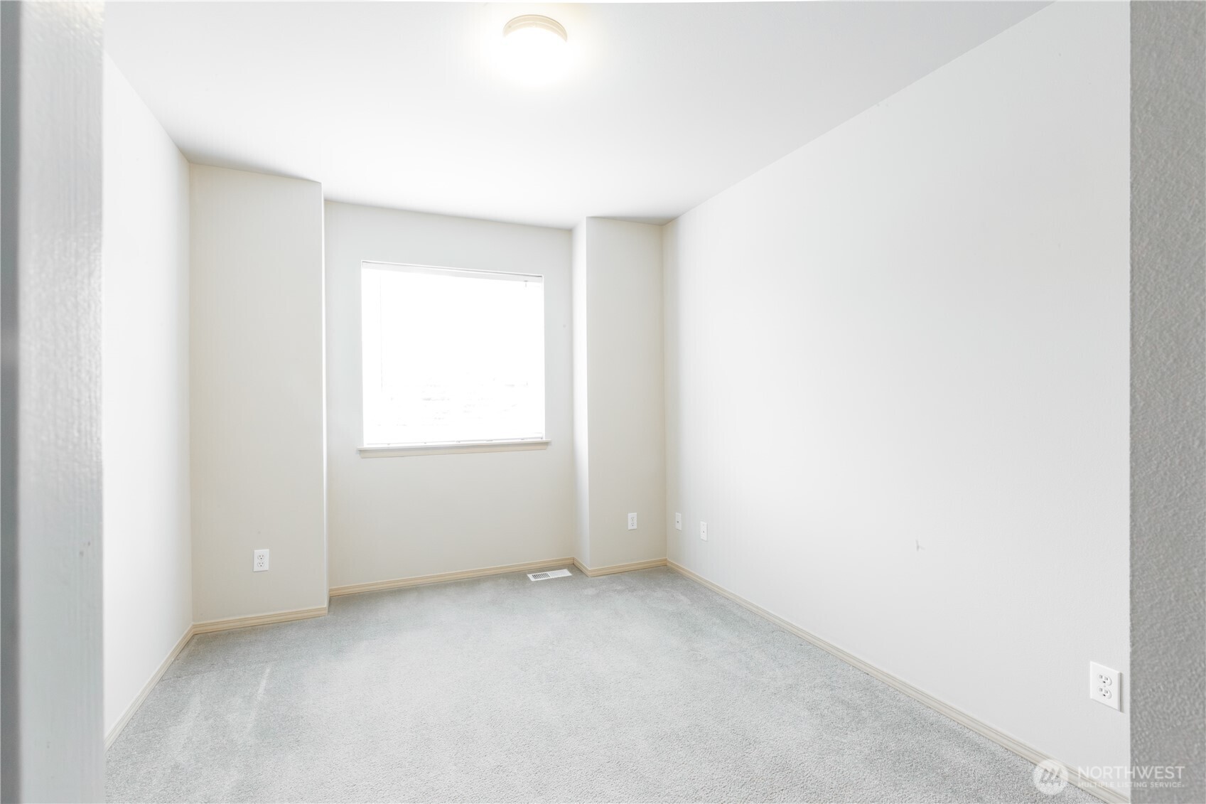 22463 Southeast 244th Street Maple Valley, WA 98038 - Photo 13 of 26 a view of an empty room with a window