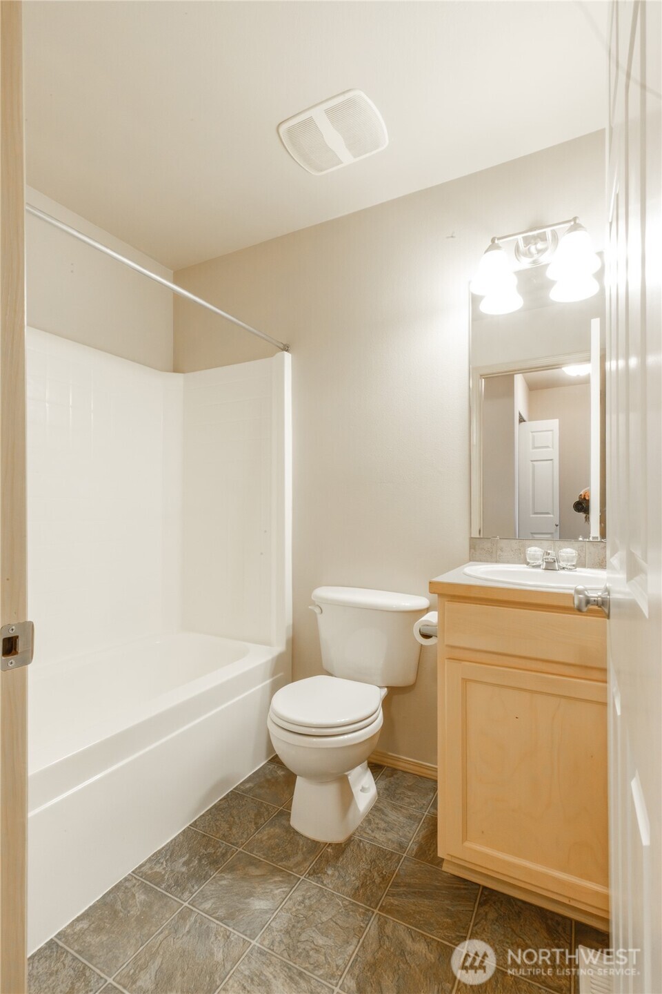22463 Southeast 244th Street Maple Valley, WA 98038 - Photo 17 of 26 a bathroom with a sink toilet and shower