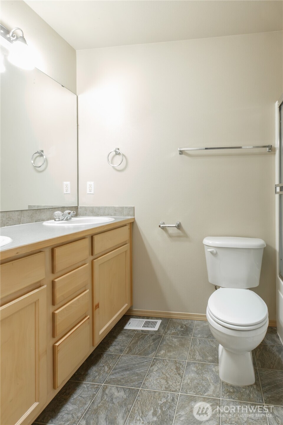 22463 Southeast 244th Street Maple Valley, WA 98038 - Photo 18 of 26 a bathroom with a granite countertop toilet and a sink