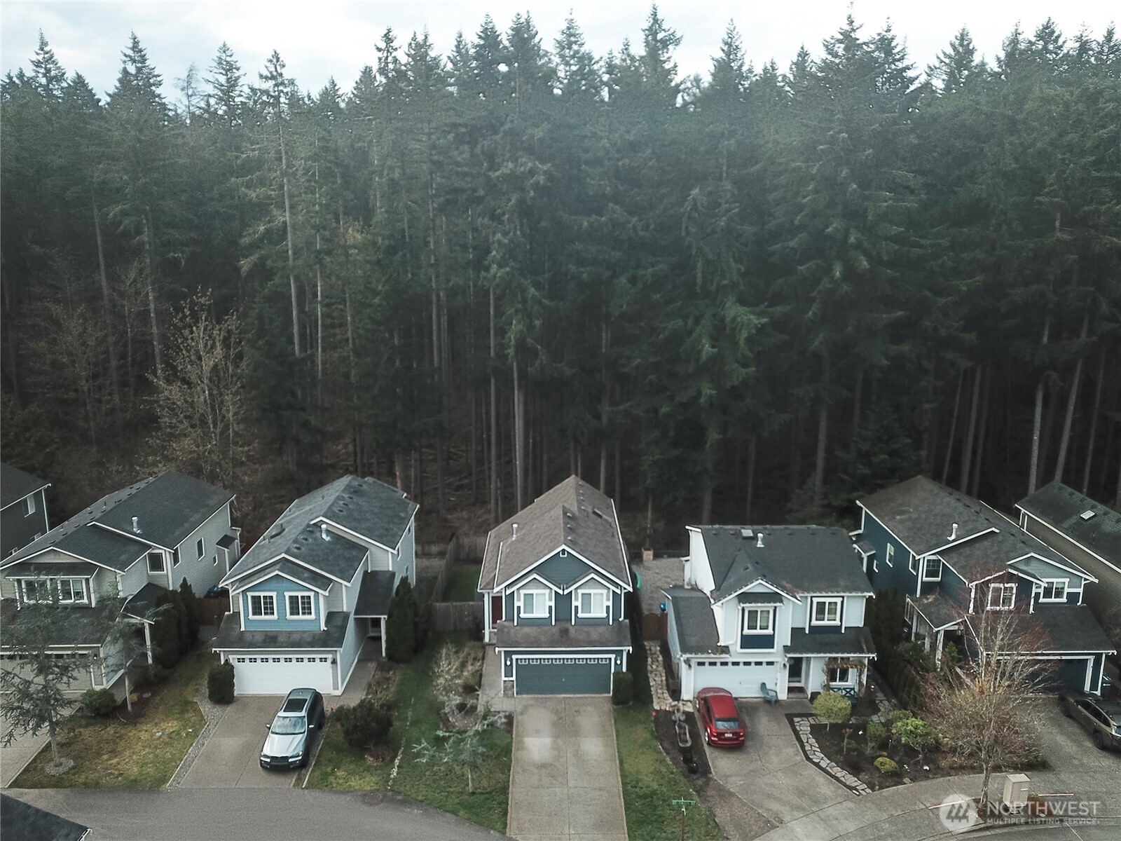 22463 Southeast 244th Street Maple Valley, WA 98038 - Photo 2 of 26 a view of multiple houses with a street