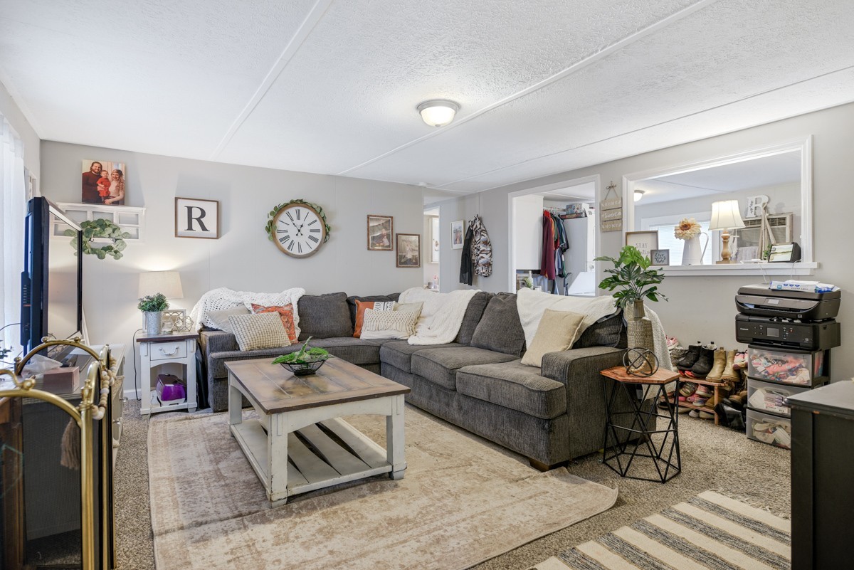 6016 Highland Road Orlinda, TN 37141 - Photo 12 of 34 a living room with furniture and a flat screen tv