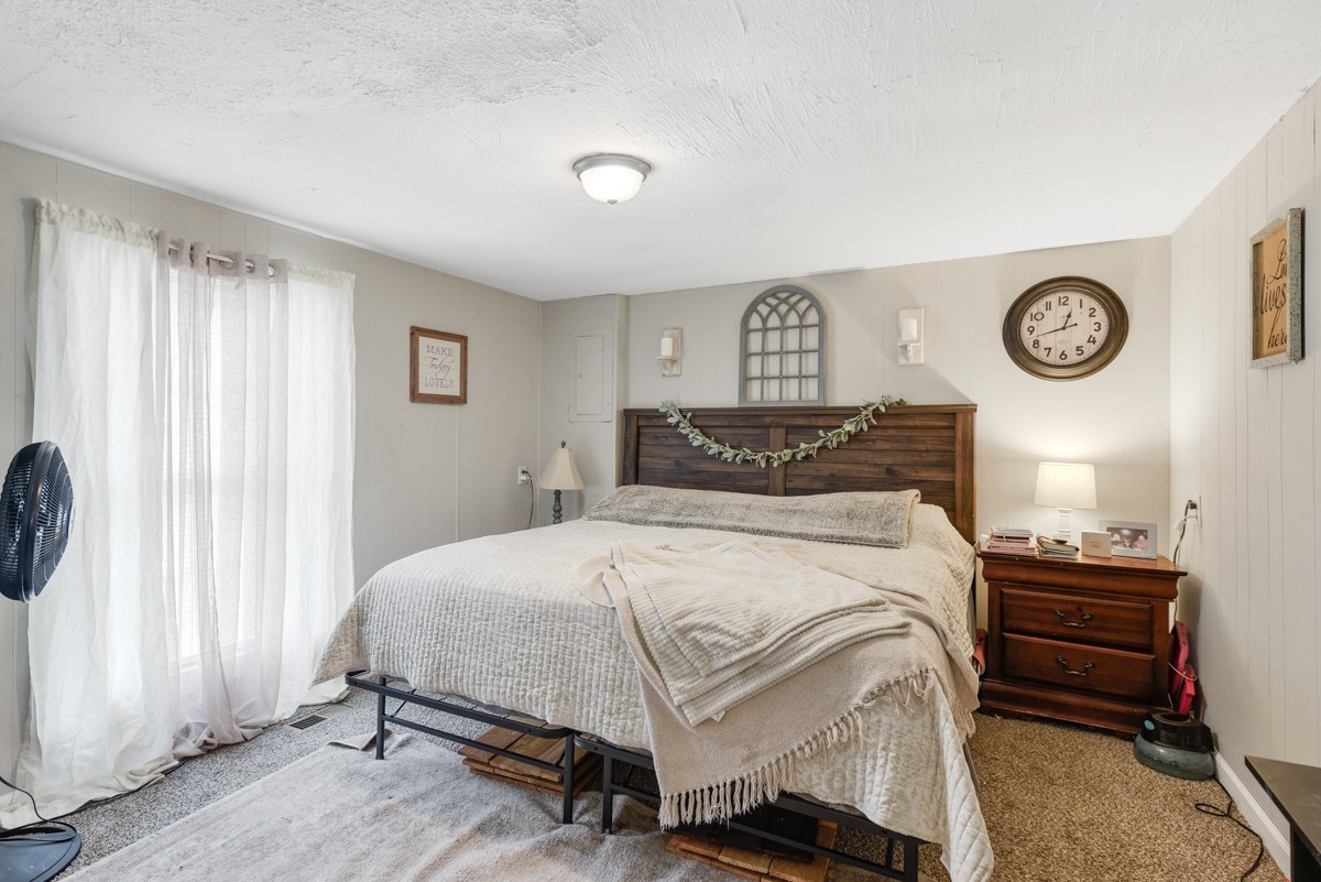 6016 Highland Road Orlinda, TN 37141 - Photo 23 of 34 a bedroom with a bed and a window