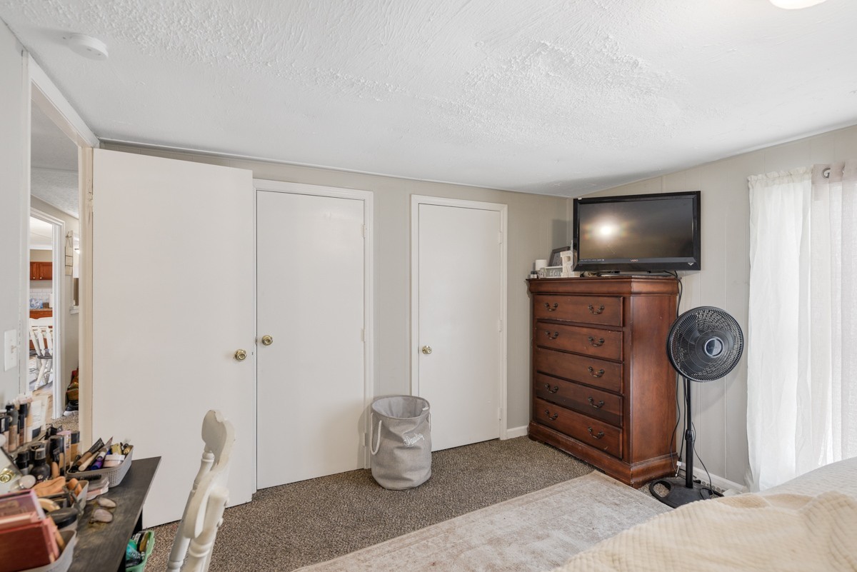 6016 Highland Road Orlinda, TN 37141 - Photo 24 of 34 a living room with furniture and a flat screen tv