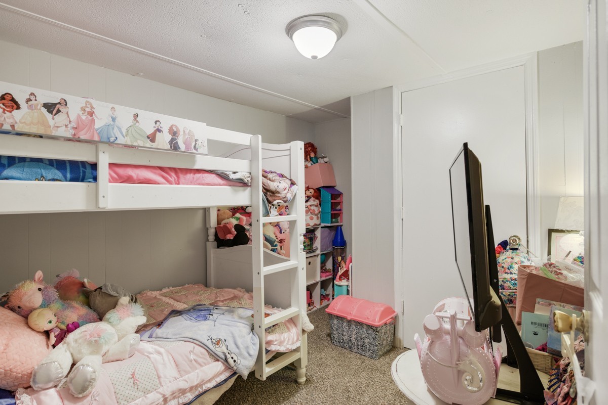 6016 Highland Road Orlinda, TN 37141 - Photo 26 of 34 a bedroom with a bed and a window