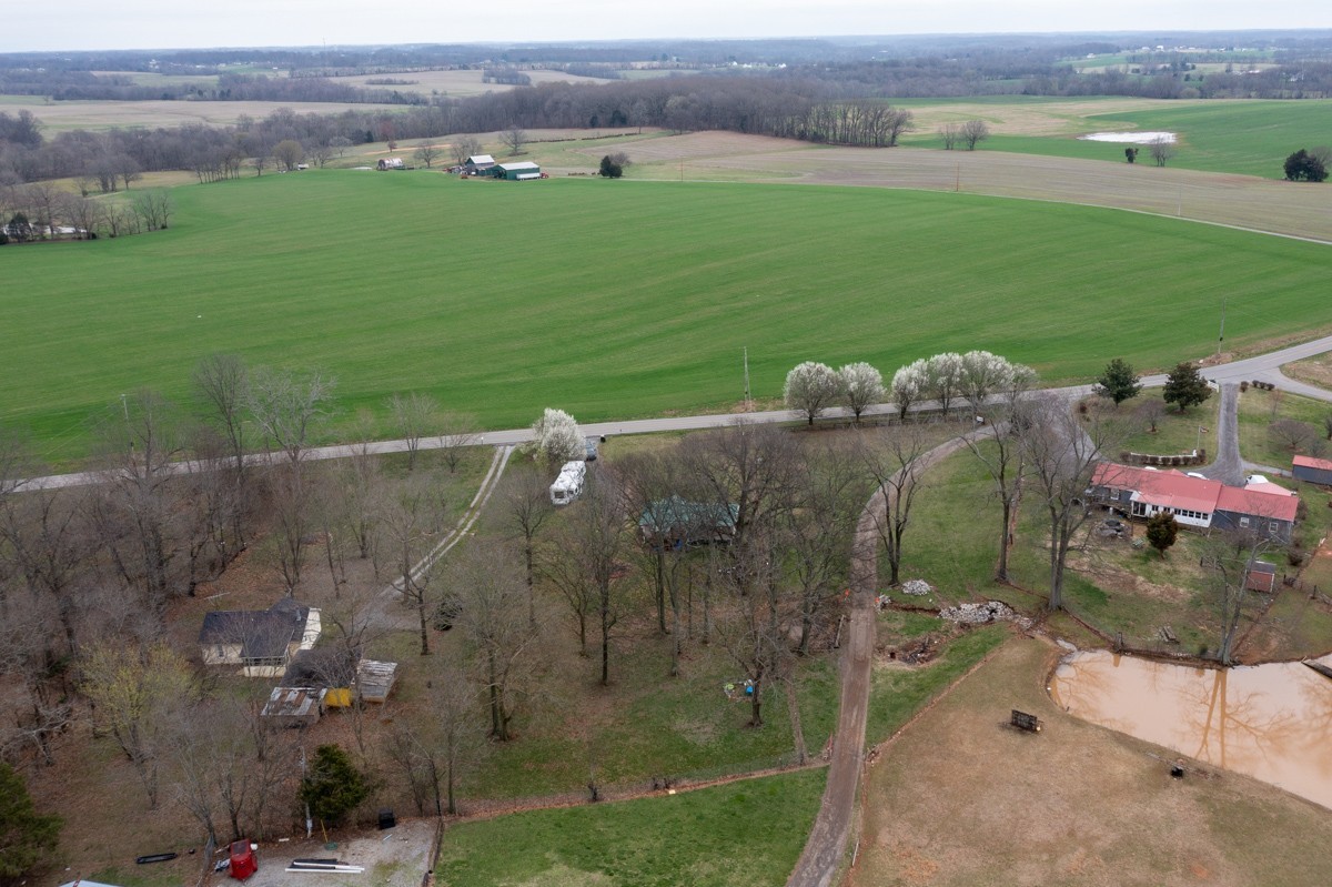 6016 Highland Road Orlinda, TN 37141 - Photo 32 of 34 an aerial view of a house with a yard basket ball court and outdoor seating