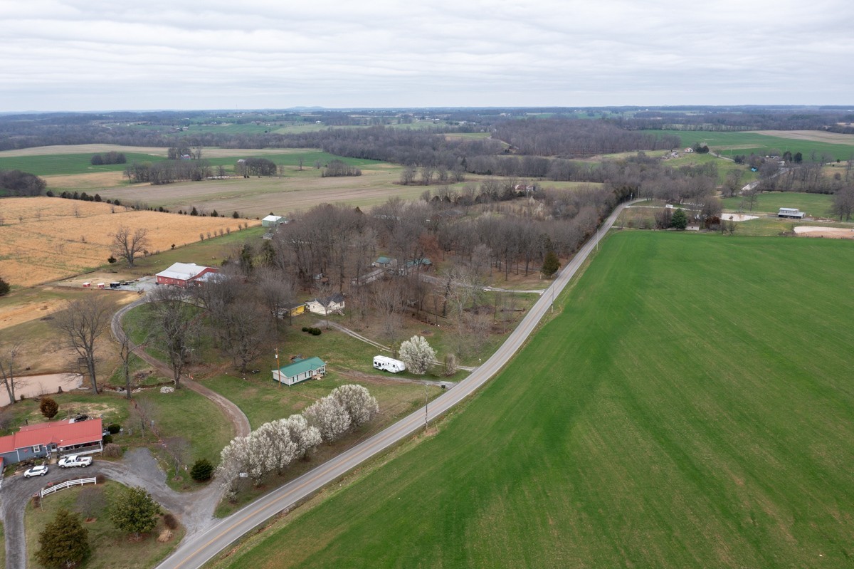 6016 Highland Road Orlinda, TN 37141 - Photo 34 of 34 an aerial view of a house with a yard