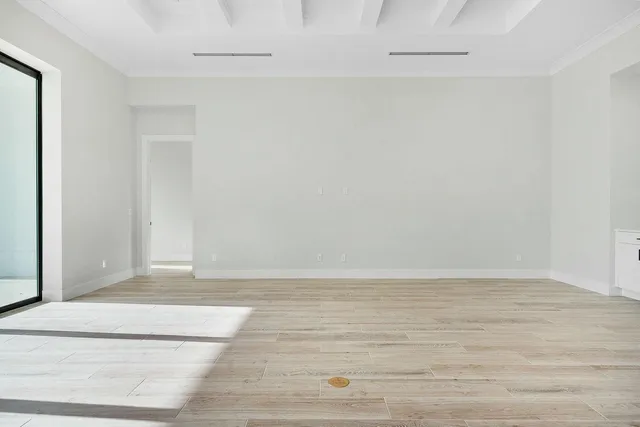 a kitchen with white cabinets and a stove