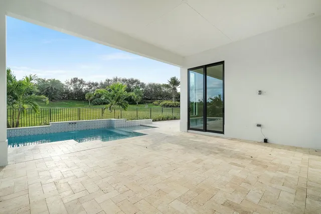 a view of a house with backyard and porch