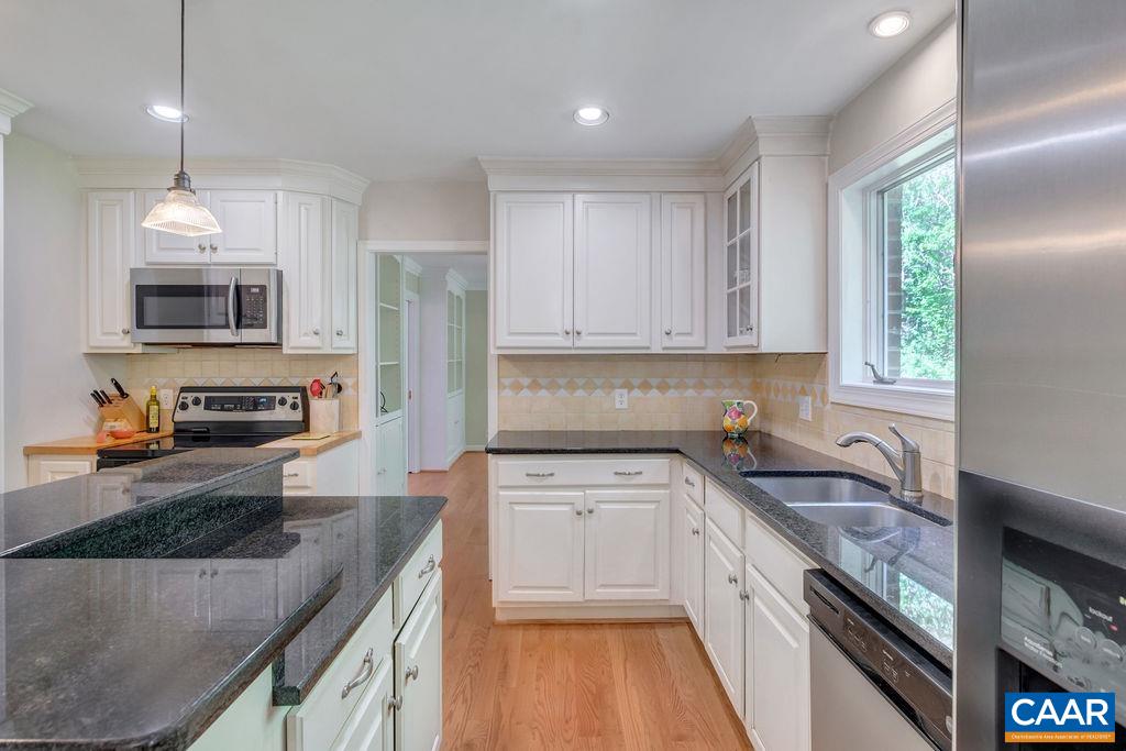 1970 Stillhouse Road Charlottesville, VA 22901 - Photo 13 of 51 a kitchen with stainless steel appliances granite countertop a sink stove and refrigerator