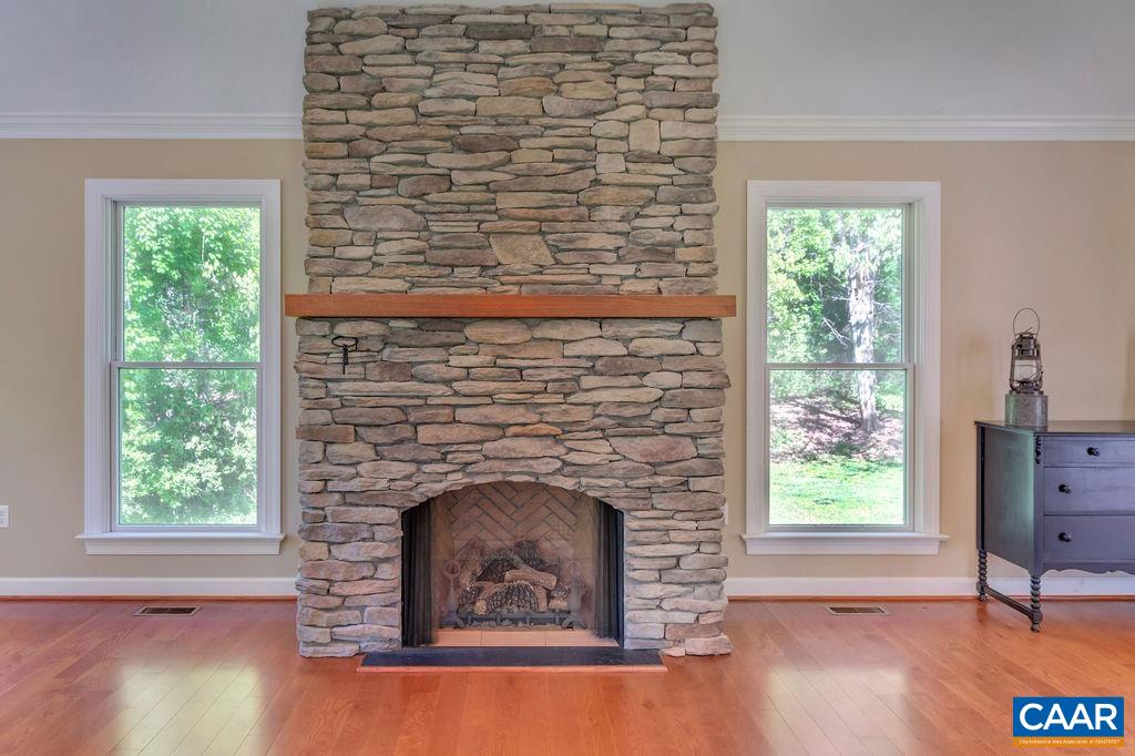 1970 Stillhouse Road Charlottesville, VA 22901 - Photo 7 of 51 a living room with a fireplace and a window