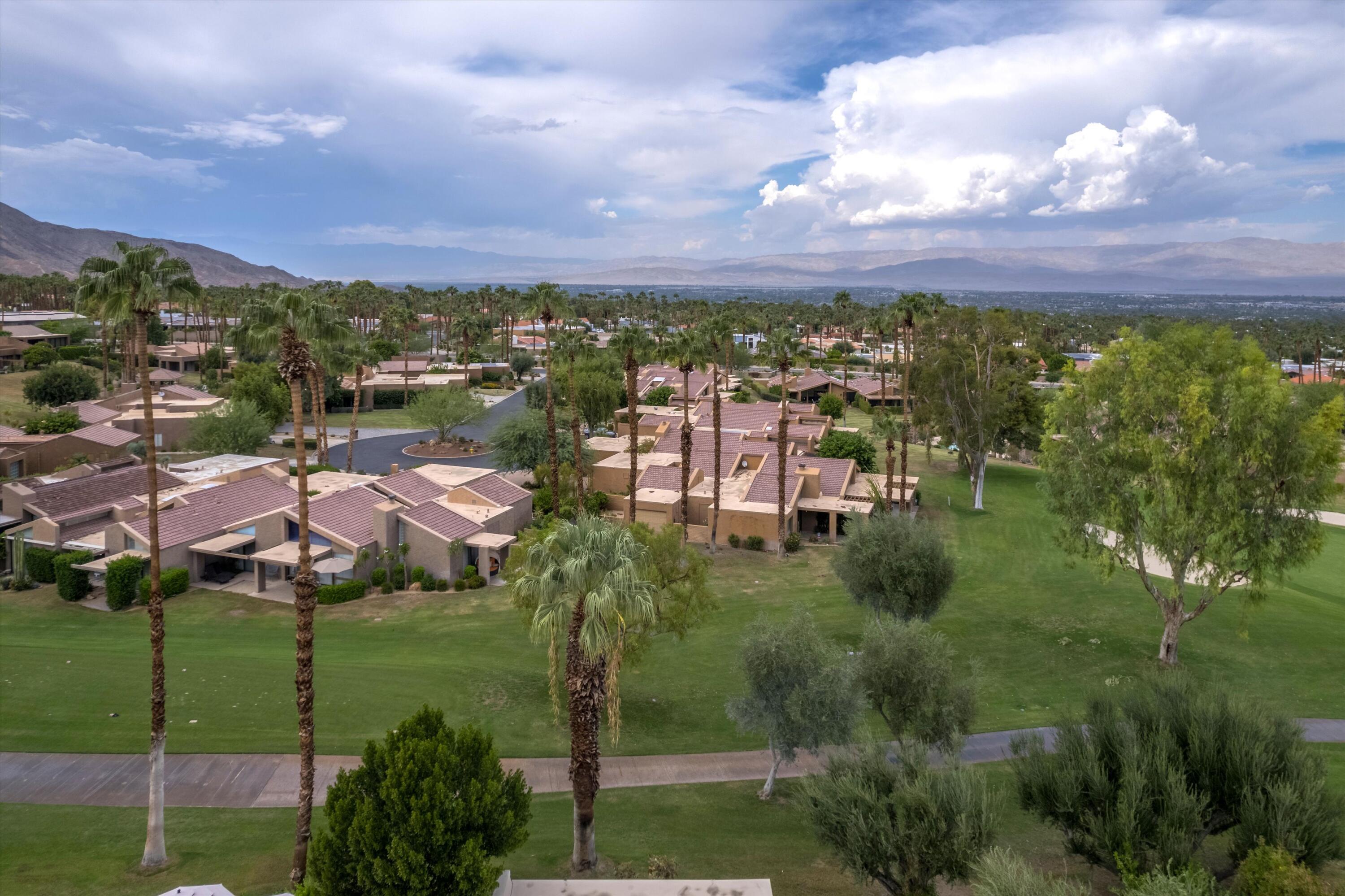 73476 Dalea Lane Palm Desert, CA 92260 - Photo 11 of 37 a view of a lake with a building in the background
