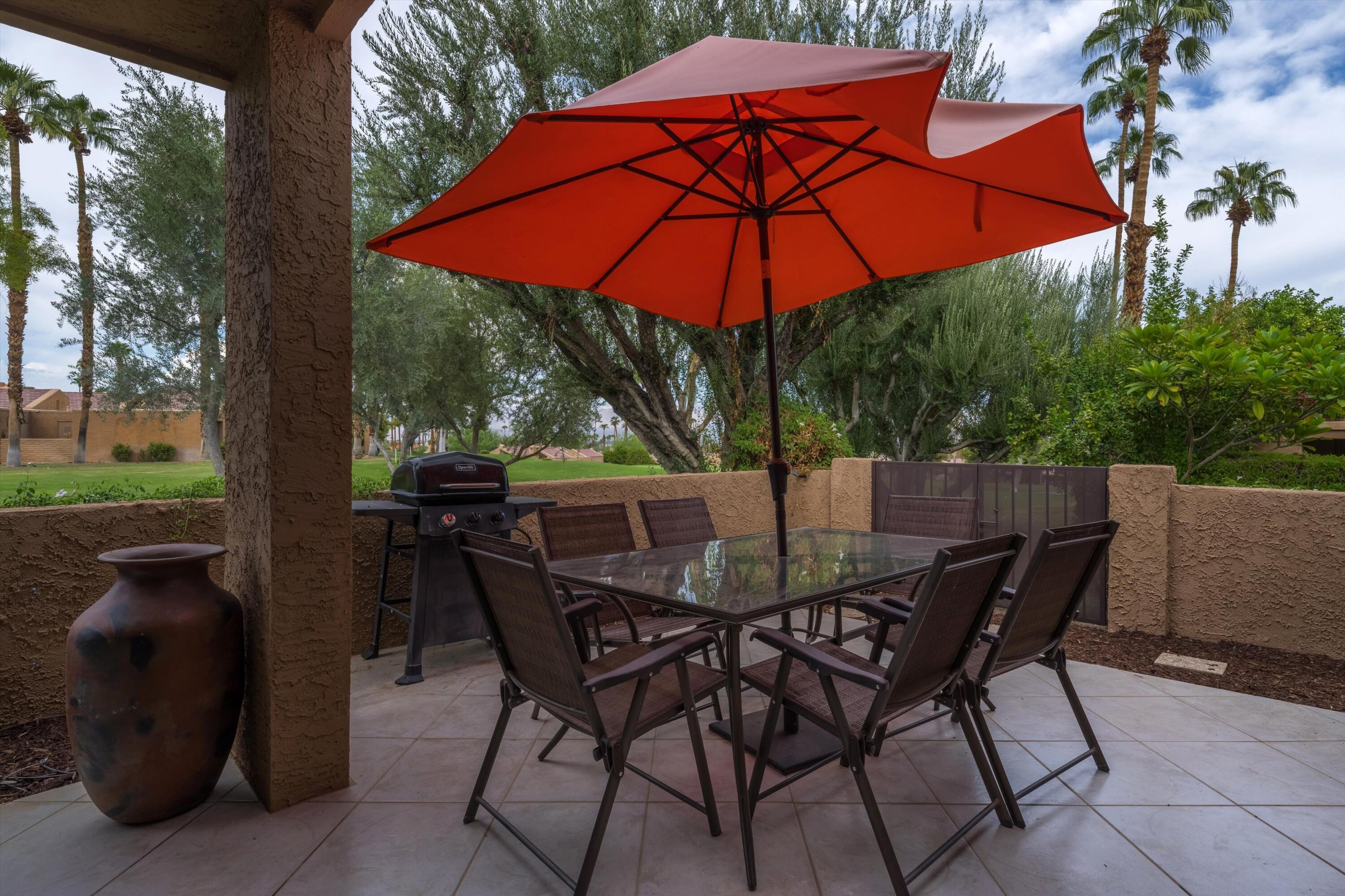 73476 Dalea Lane Palm Desert, CA 92260 - Photo 18 of 37 a view of an outdoor sitting area with furniture and backyard