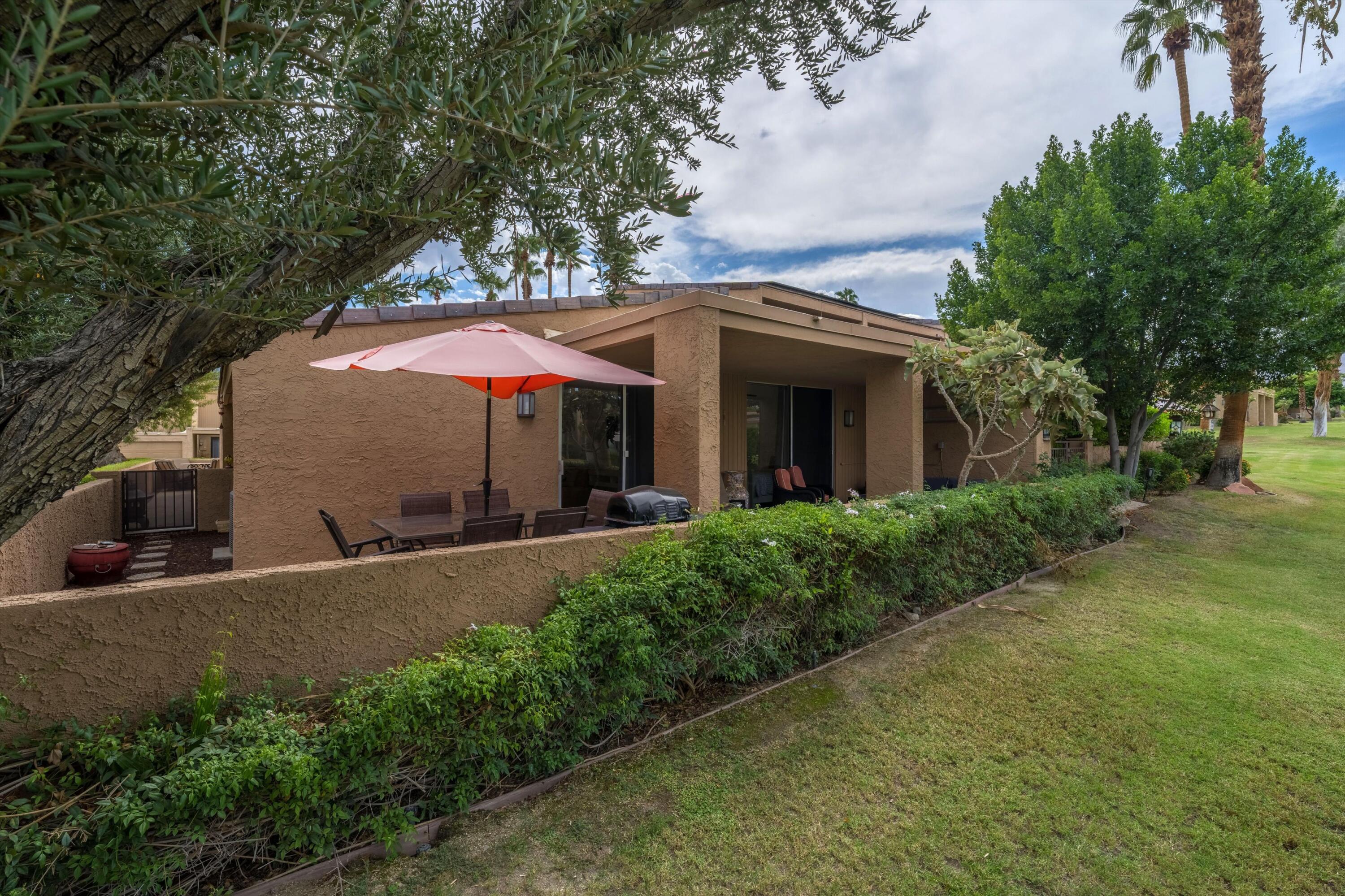 73476 Dalea Lane Palm Desert, CA 92260 - Photo 22 of 37 a view of a house with a yard and tree s
