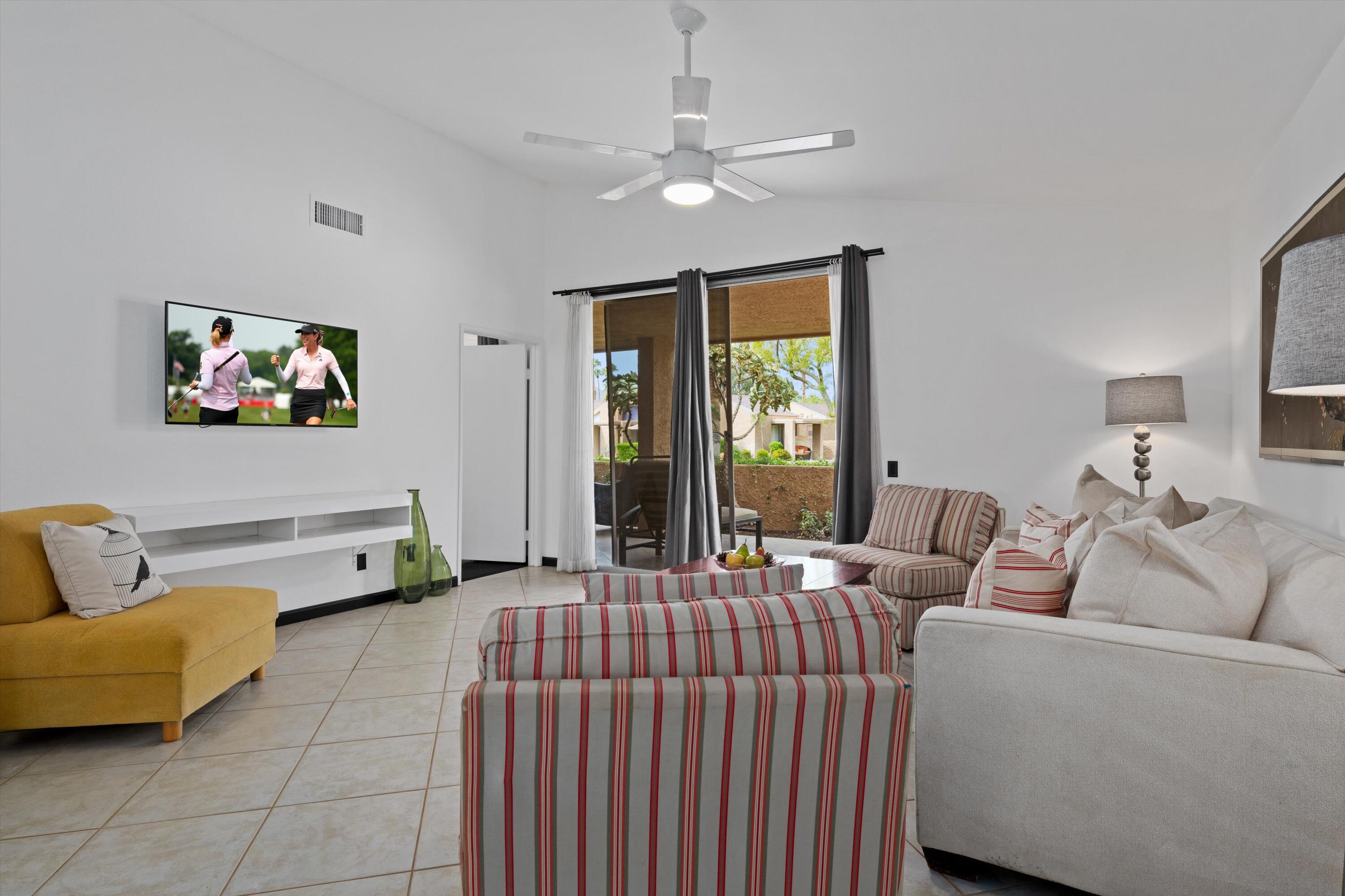 73476 Dalea Lane Palm Desert, CA 92260 - Photo 27 of 37 a living room with furniture and a ceiling fan