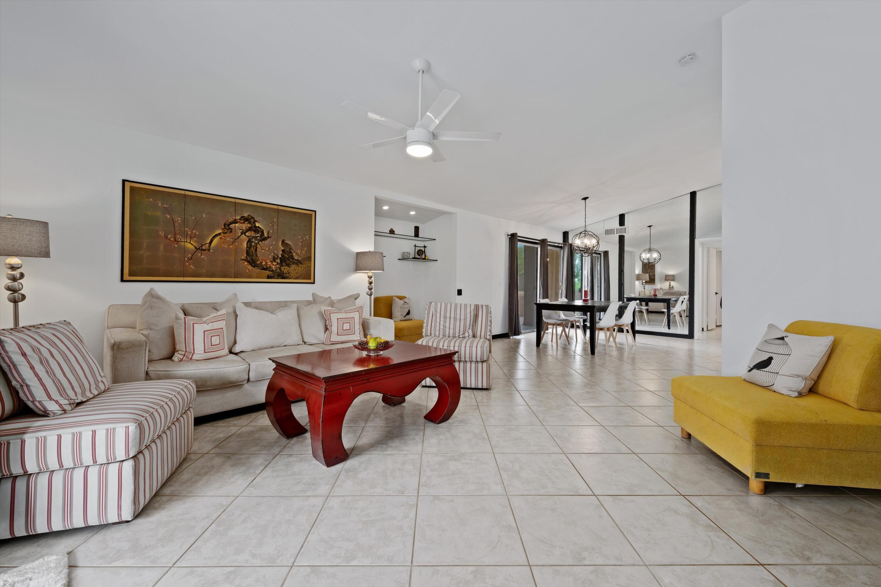 73476 Dalea Lane Palm Desert, CA 92260 - Photo 28 of 37 a living room with furniture and wooden floor