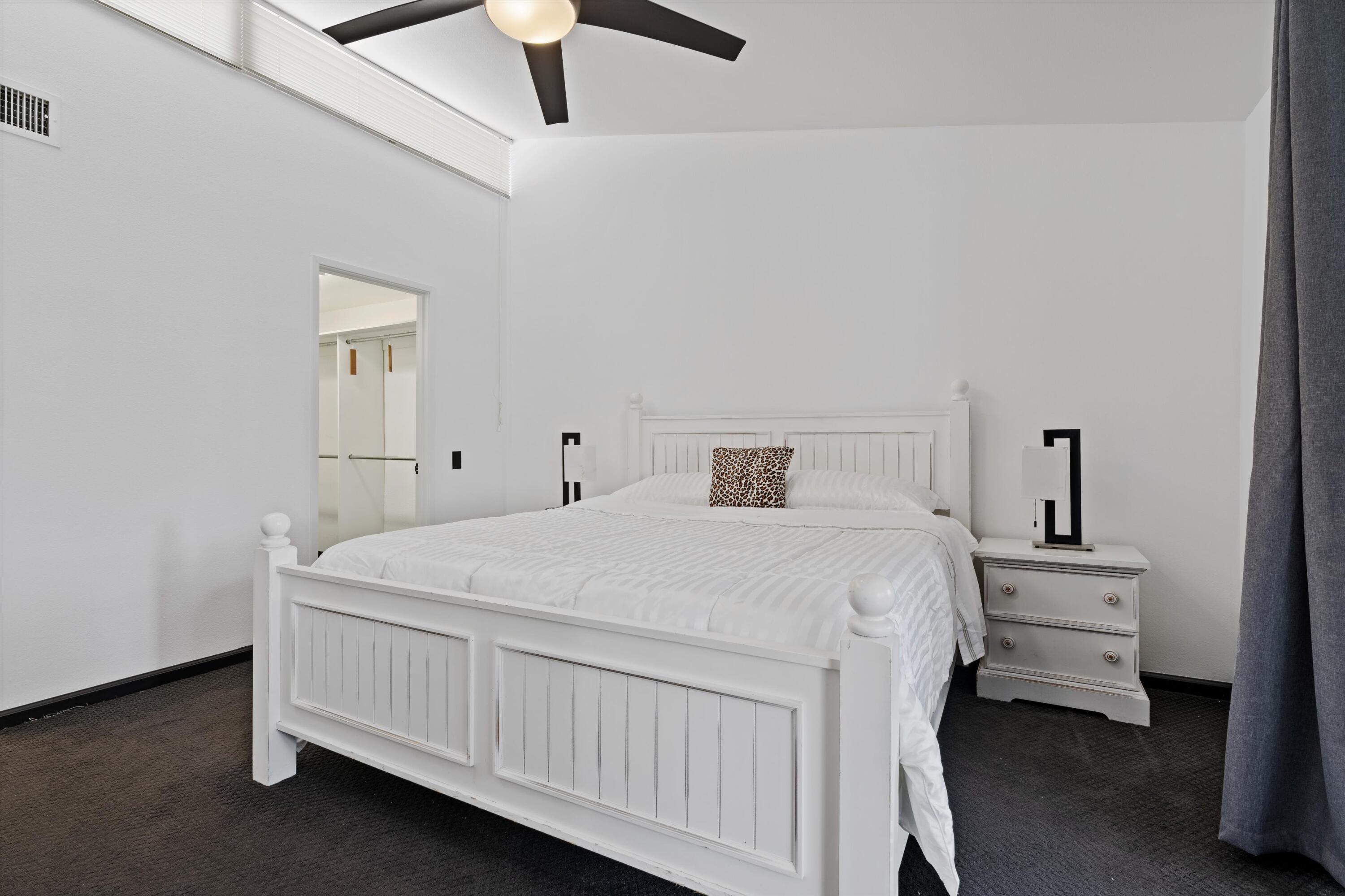 73476 Dalea Lane Palm Desert, CA 92260 - Photo 29 of 37 a bedroom with a bed and a ceiling fan