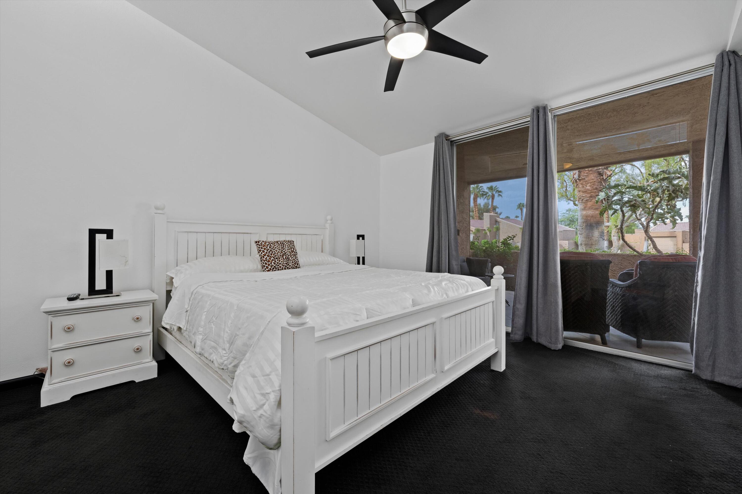 73476 Dalea Lane Palm Desert, CA 92260 - Photo 32 of 37 a bedroom with a large bed and a window