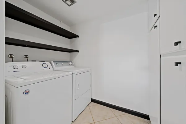 a bed sitting in a room next to a window