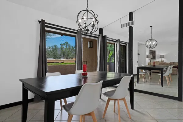 a bathroom with a bathtub shower sink vanity and toilet